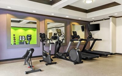 Fitness center with cardio equipment and workout space at La Quinta Inn & Suites By Wyndham Houston Energy Corridor.