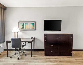 In-room workspace with desk and television at La Quinta Inn & Suites By Wyndham Houston Energy Corridor.