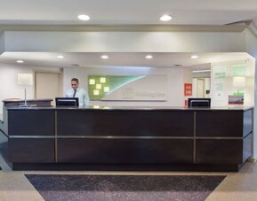 Front reception desk and check-in area at Holiday Inn Downtown Shreveport.