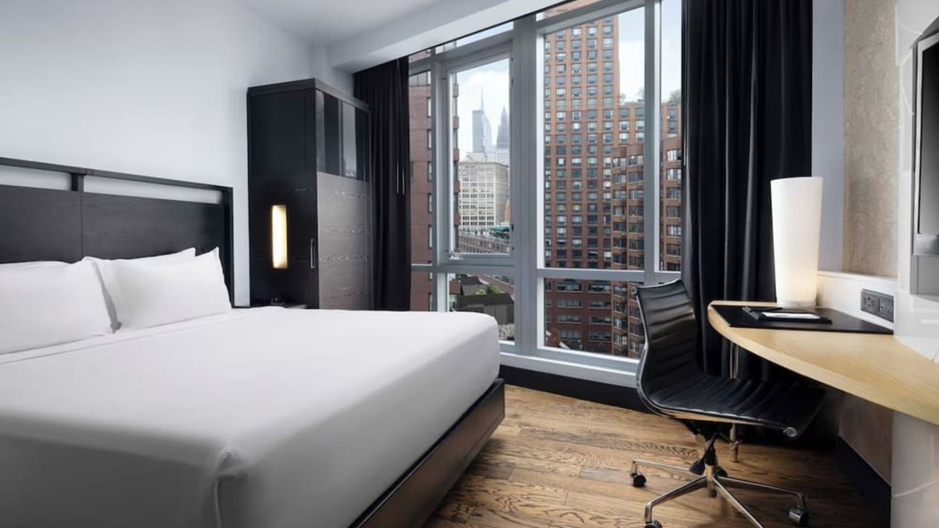 Guest room with skyline views and dedicated workspace at Hyatt Union Square New York.