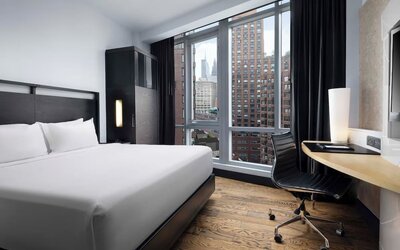 Guest room with skyline views and dedicated workspace at Hyatt Union Square New York.