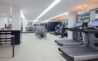 Spacious fitness facility with treadmills and strength-training equipment at Hyatt Union Square New York.
