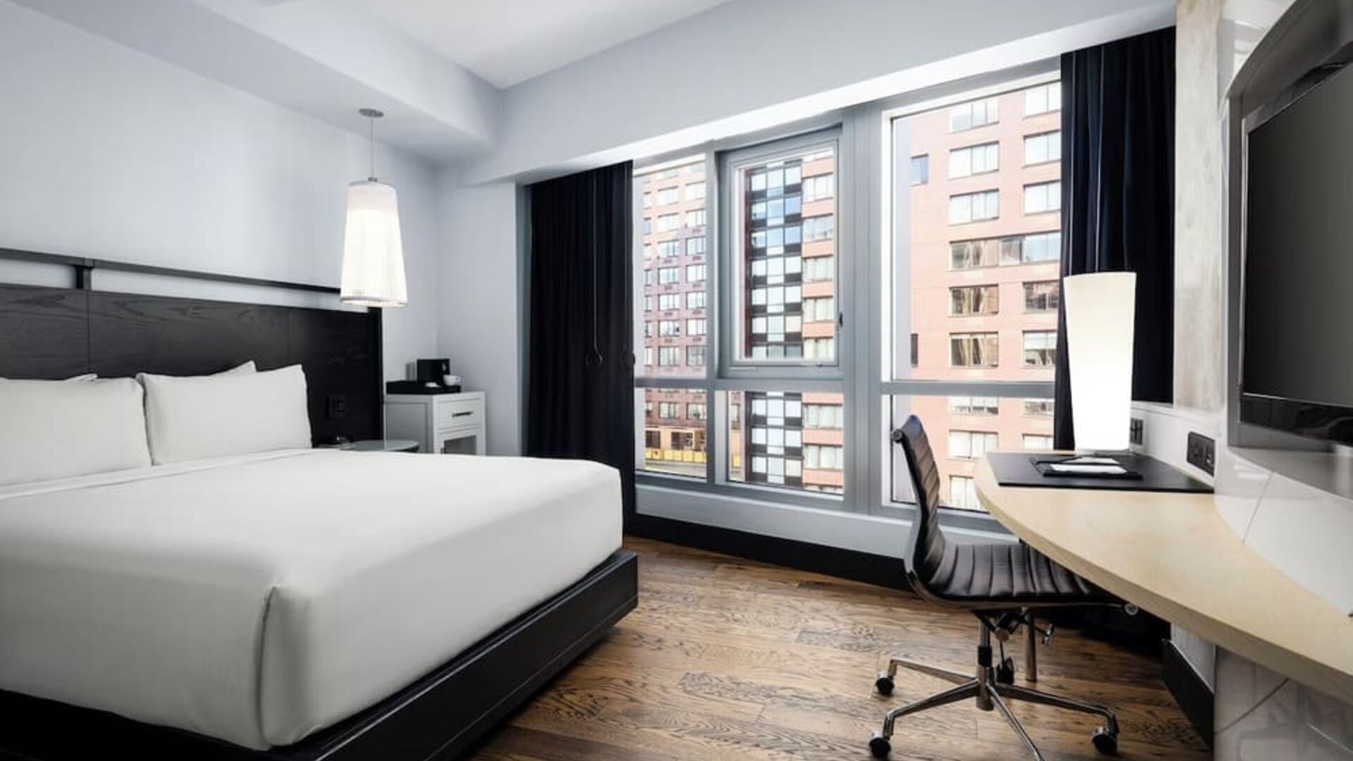 Modern king guest room with workspace and city views at Hyatt Union Square New York.
