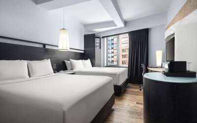 Double queen guest room with modern design and city views at Hyatt Union Square New York.