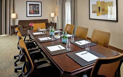 Professional meeting room with conference table setup, ergonomic seating, and business-friendly amenities at The Bostonian Boston, A Millennium Hotel.