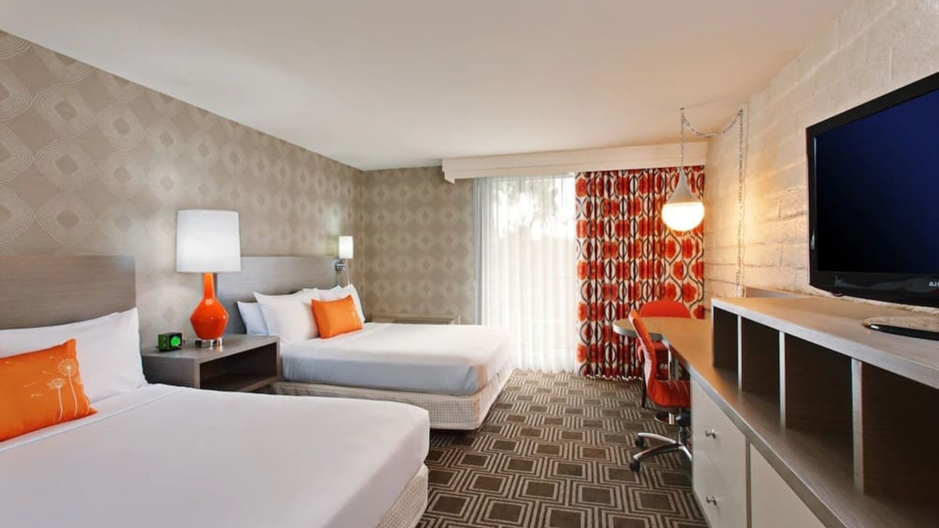 Modern double-bed guest room offering comfortable accommodations, workspace amenities, and contemporary décor at The Garland.