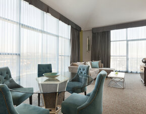 Living area inside day use room at Embassy Suites By Hilton Brea North Orange County.