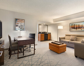 Living area inside day use room at Embassy Suites By Hilton Brea North Orange County.