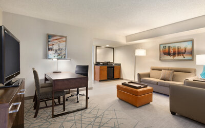 Living area inside day use room at Embassy Suites By Hilton Brea North Orange County.