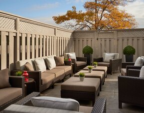 Outdoor patio with lounge sitting at Courtyard By Marriott Toronto Airport.