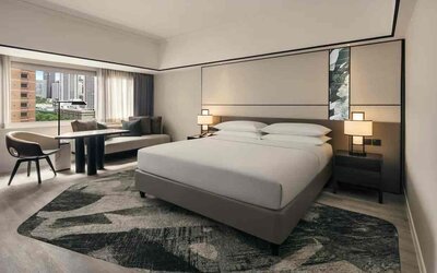 King size bed in a deluxe room with great city view at the Hilton Singapore Orchard.