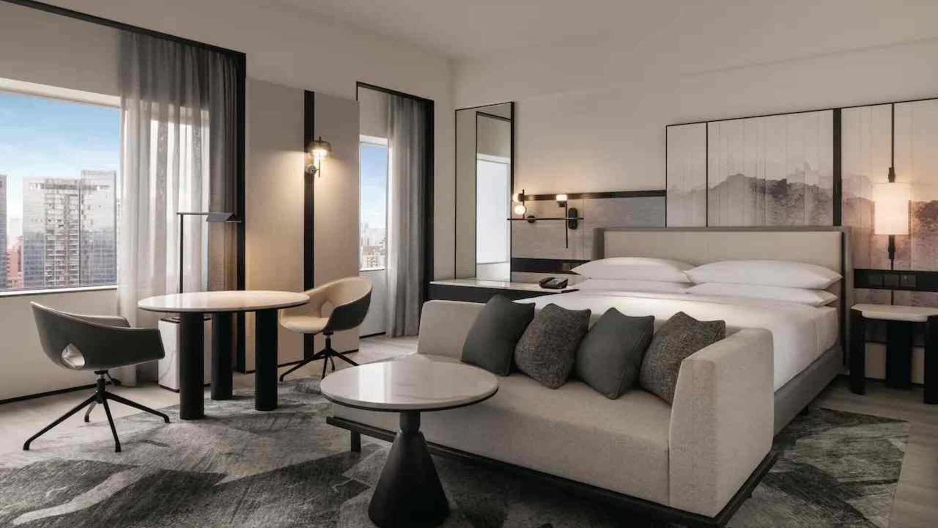 King family room with lounge, working station and city view at the Hilton Singapore Orchard.