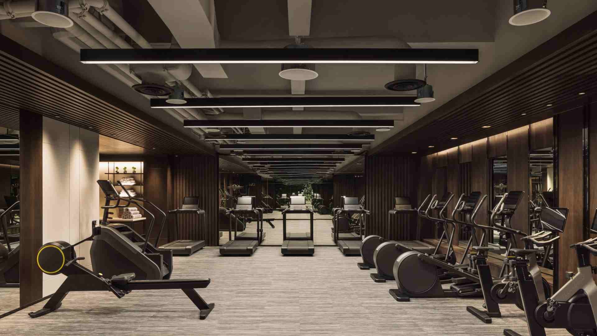 Stylish fitness center with treadmills and excercise bikes at the Hilton Singapore Orchard.
