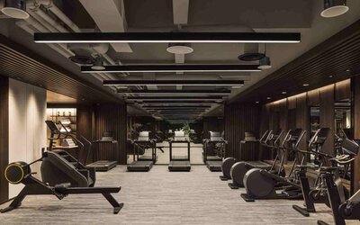 Stylish fitness center with treadmills and excercise bikes at the Hilton Singapore Orchard.