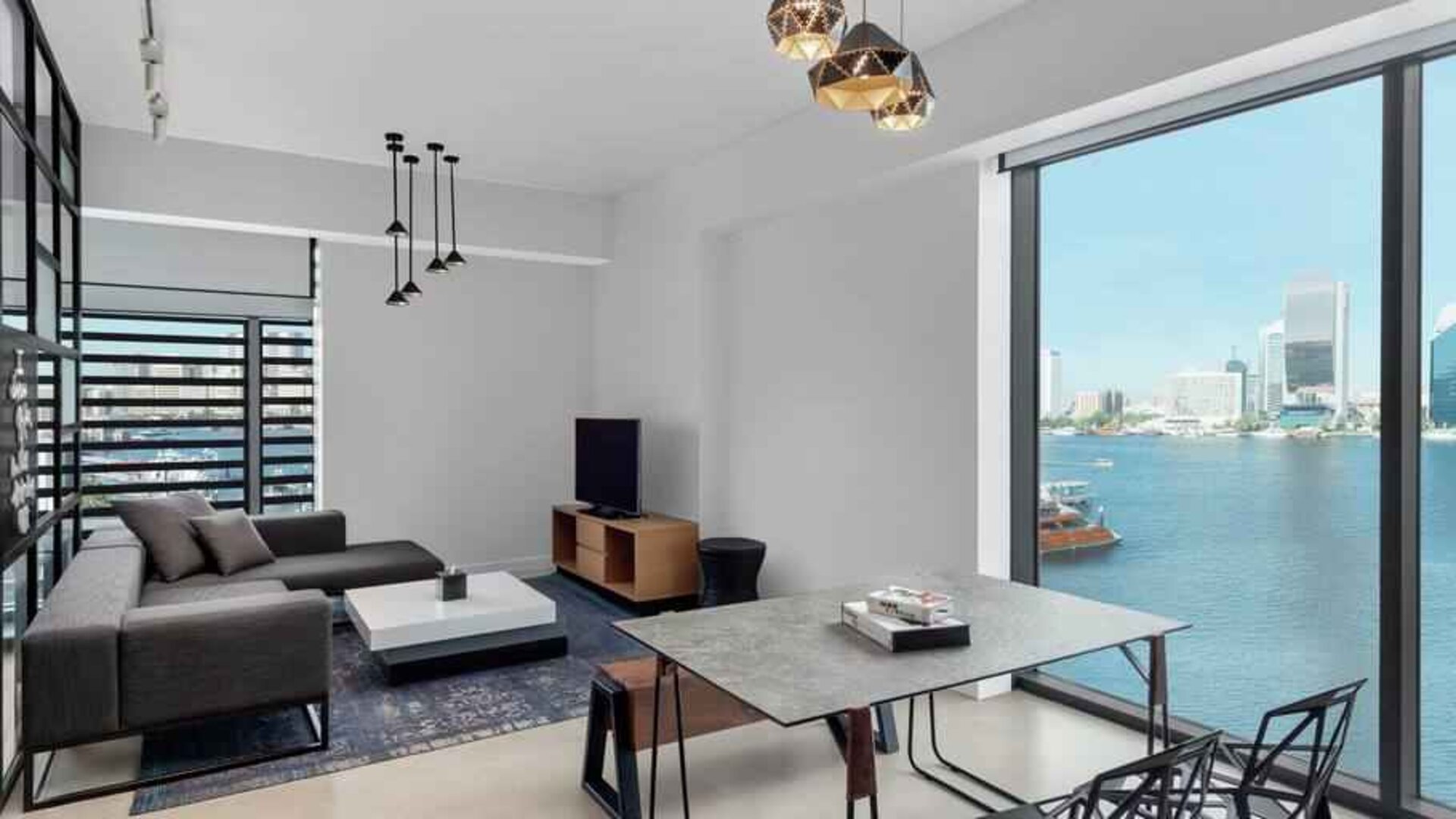 Oversized king suite with living room and superb creek view at the Canopy by Hilton Dubai Al Seef.