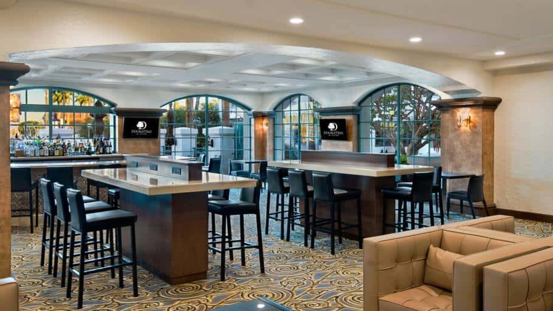 Seating islands with abundant charge ports near bar in main lobby. Perfect for remote working with a cocktail.