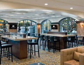 Seating islands with abundant charge ports near bar in main lobby. Perfect for remote working with a cocktail.