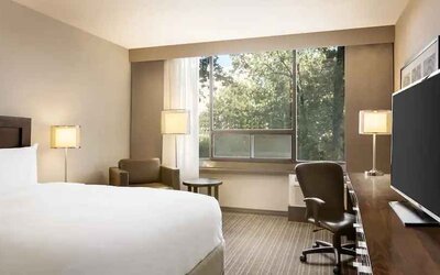 Comfortable deluxe queen room with window view at the Double Tree Toronto Airport West.