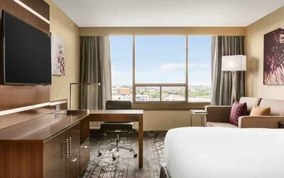 King size bed in a king deluxe room at the Double Tree Toronto Airport West.