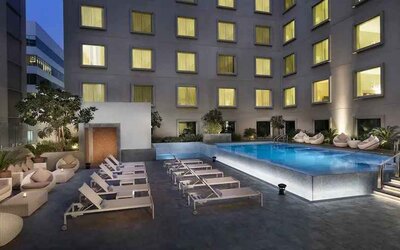 Relaxing outdoor pool area at the Hilton Garden Inn Dubai Mall of the Emirates.