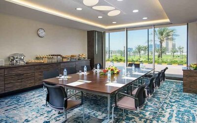Bright meeting room perfect for small groups at the Hilton Ras Al Khaimah Beach Resort.