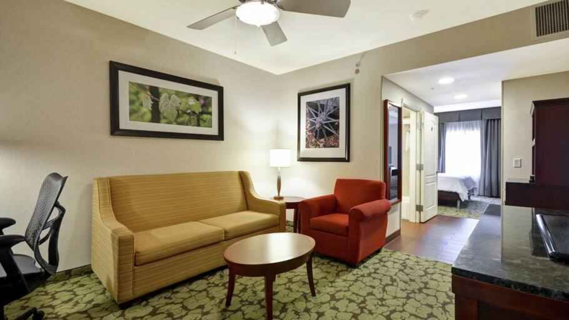 Spacious living room in a king guestroom at the Hilton Garden Inn Fort Collins.