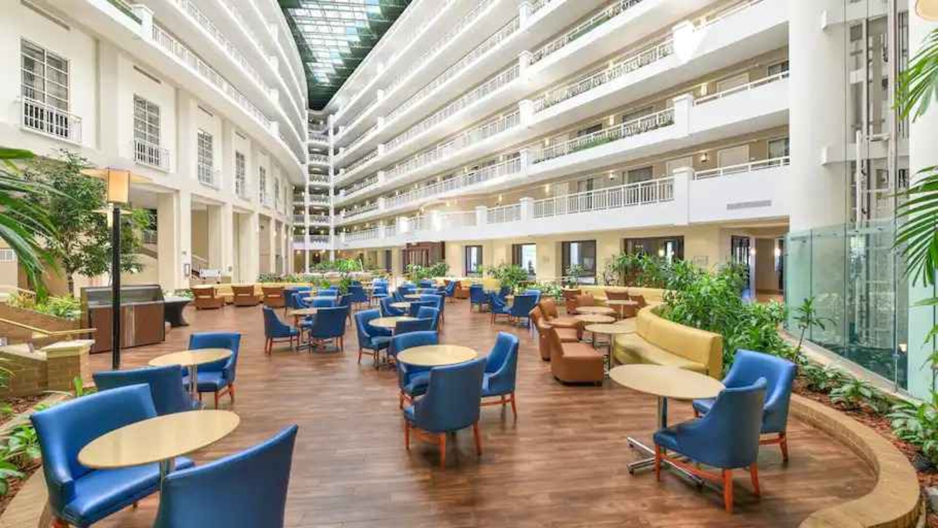 Beautiful and bright outdoor workspace with sofas and chairs at the Embassy Suites by Hilton Alexandria-Old Town.