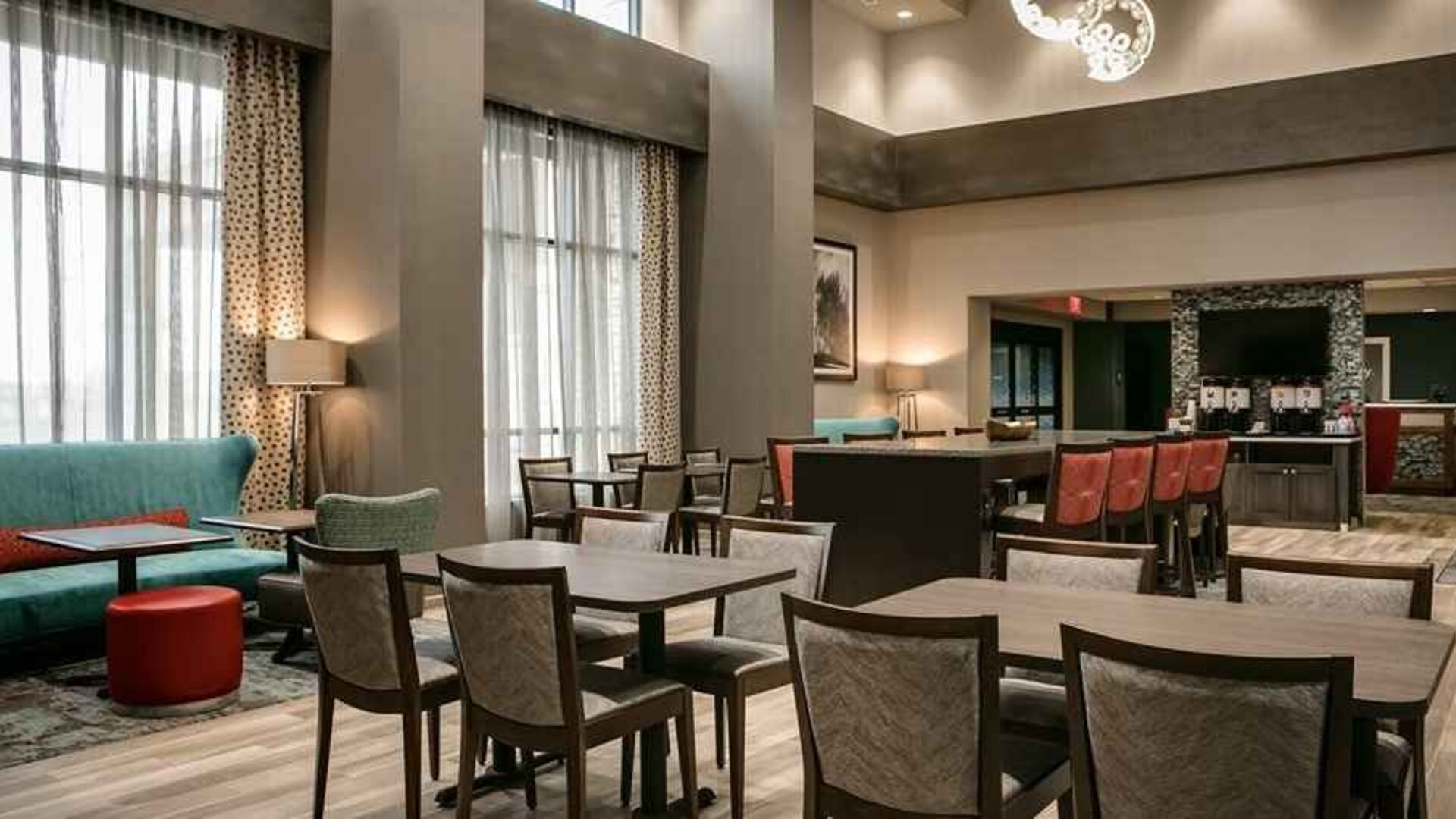 Well-lit, spacious lounge and work area for coworking at Hampton Inn Wichita Northwest.