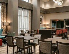 Well-lit, spacious lounge and work area for coworking at Hampton Inn Wichita Northwest.