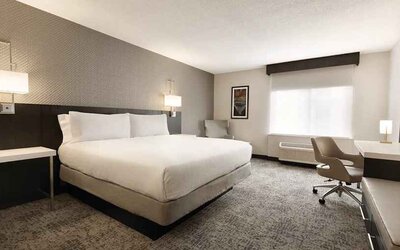 Cozy king bedroom with work desk at Hilton Garden Inn Washington DC Downtown.