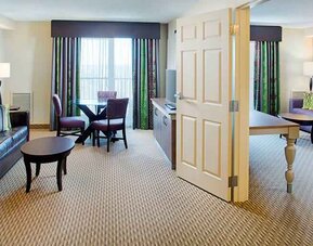Spacious king suite with king bedroom and living room at the Hilton Garden Inn Hartford North/Bradley Intl Airport.