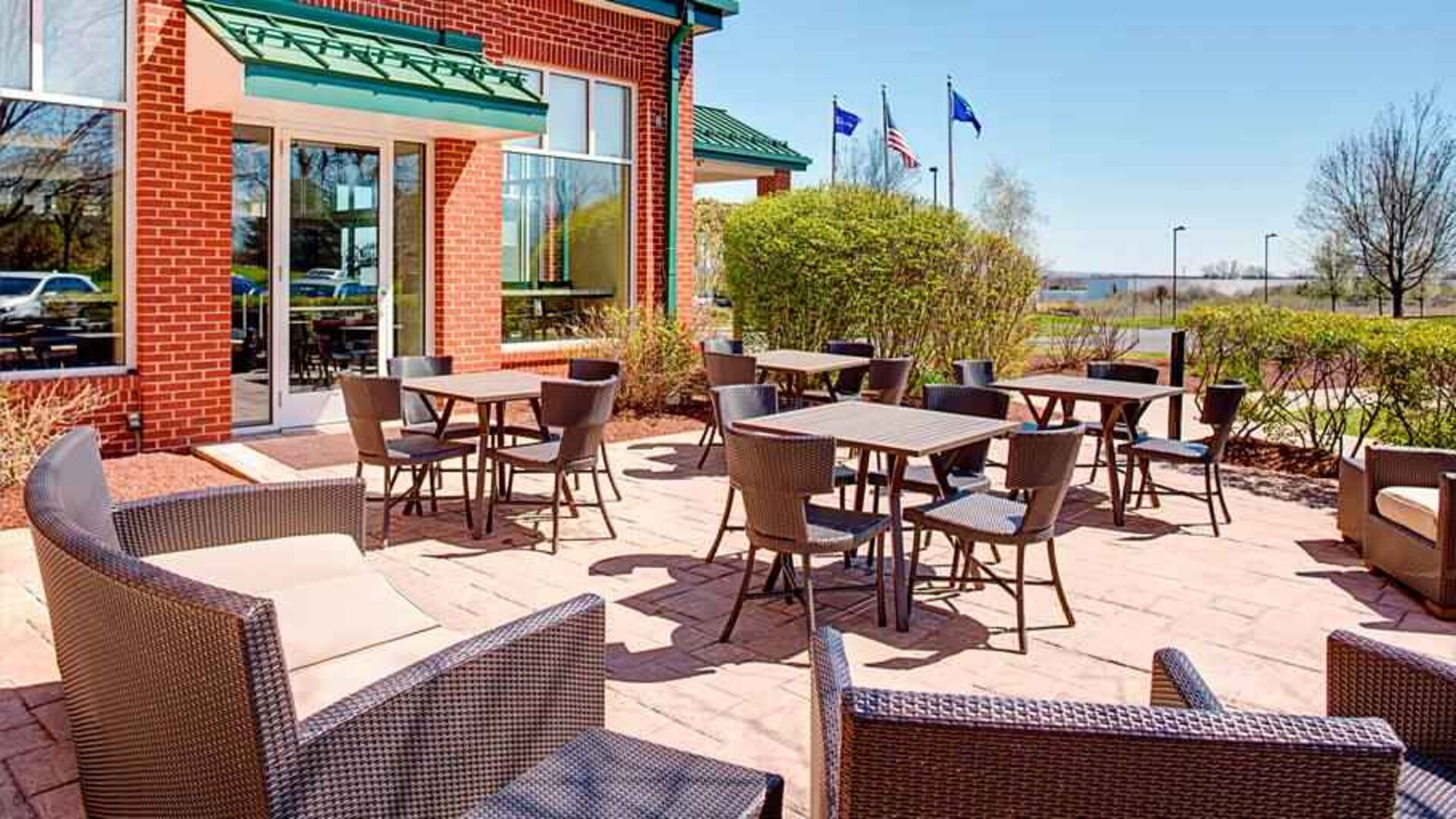 Beautiful outdoor terrace suitable as workspace at the Hilton Garden Inn Hartford North/Bradley Intl Airport.