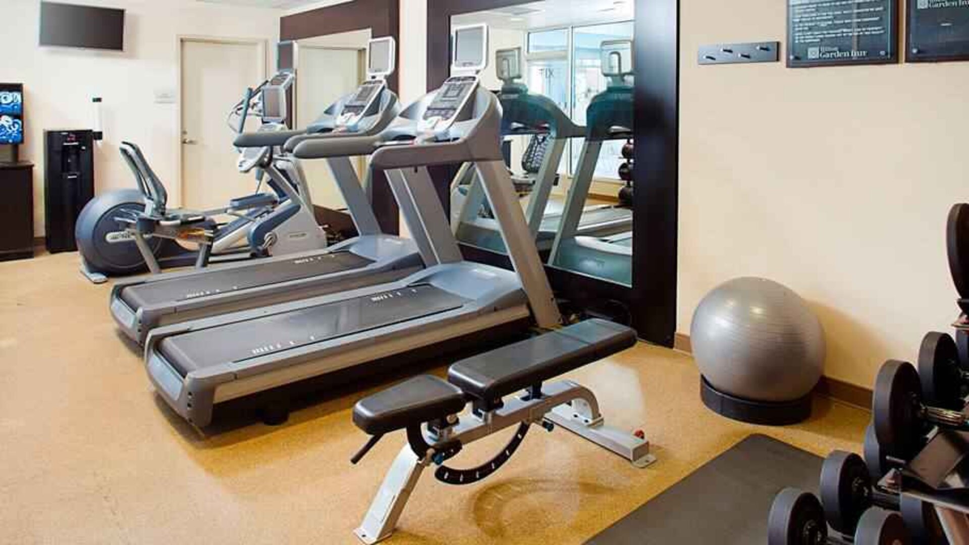 Fitness center with treadmills at the Hilton Garden Inn Hartford North/Bradley Intl Airport.