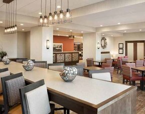 Bright-lit lobby and coworking space at Hampton Inn By Hilton, Salt Lake City Cottonwood.