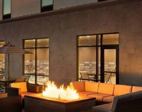 Beautiful outdoor patio with comfortable seating and coworking space at Hampton Inn By Hilton, Salt Lake City Cottonwood.