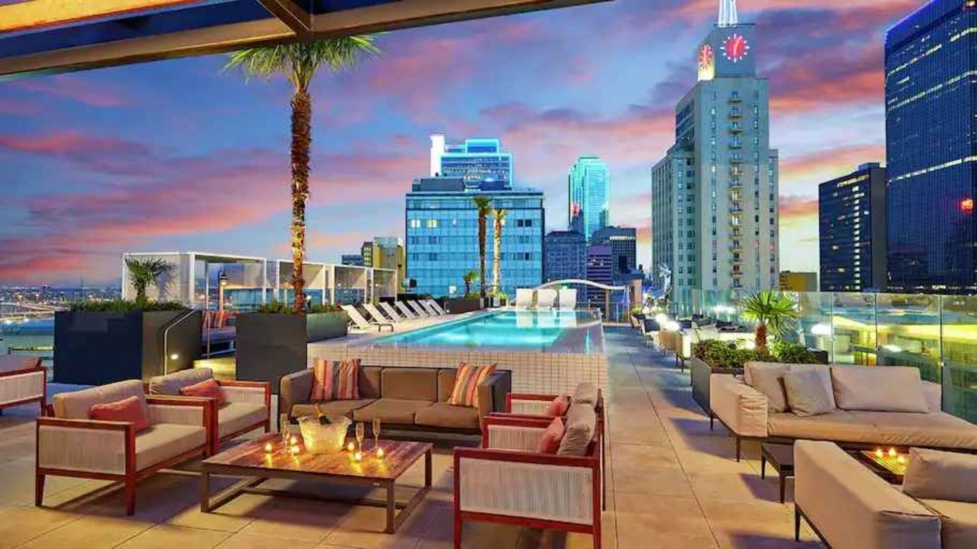 Stunning rooftop with pool and seating area perfect as workspace at the Statler Dallas, Curio Collection by Hilton.