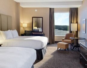 Spacious room with 2 queen beds, work desk and view of the harbour at the Hilton Saint John.