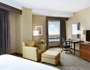 Day use room with work desk and lounge area at the Hilton Saint John.