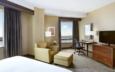 Day use room with work desk and lounge area at the Hilton Saint John.