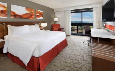 Bright and spacious day use room with view, work desk, sofa and private bathroom at Hilton Mississauga Meadowvale.