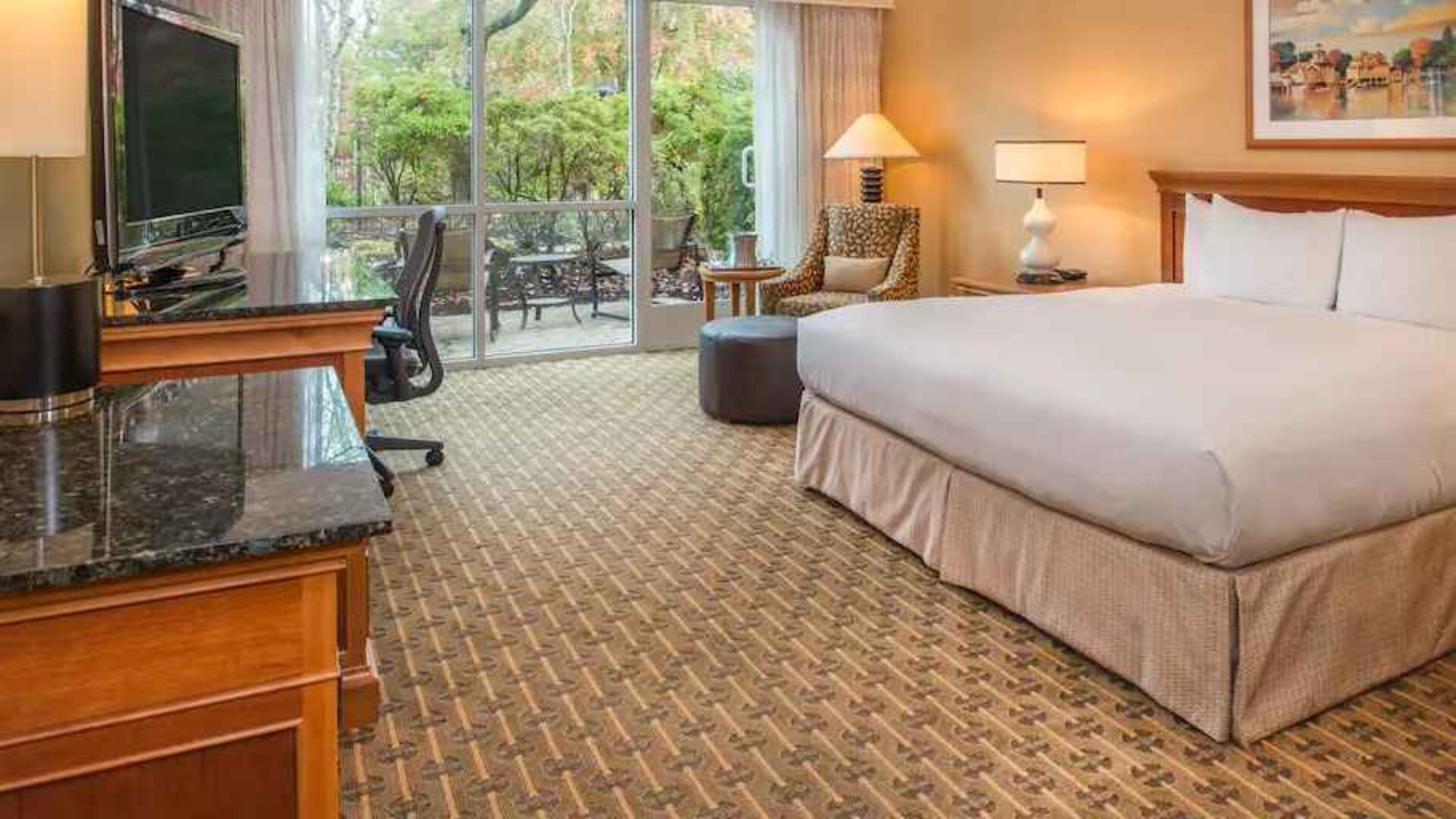 Spacious and comfortable king suite with balcony at the Hilton Seattle Airport & Conference Center.