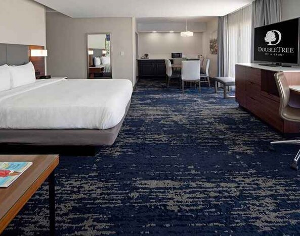 Spacious king suite with work desk and lounge area at DoubleTree by Hilton Hotel Bakersfield.
