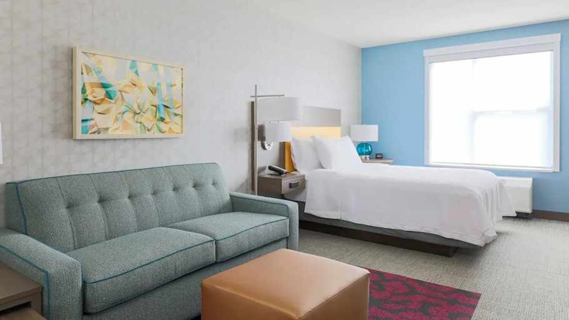colourful king-sized bed with natural light at Home2 Suites by Hilton West Sacramento.