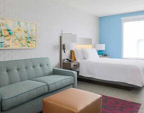 colourful king-sized bed with natural light at Home2 Suites by Hilton West Sacramento.