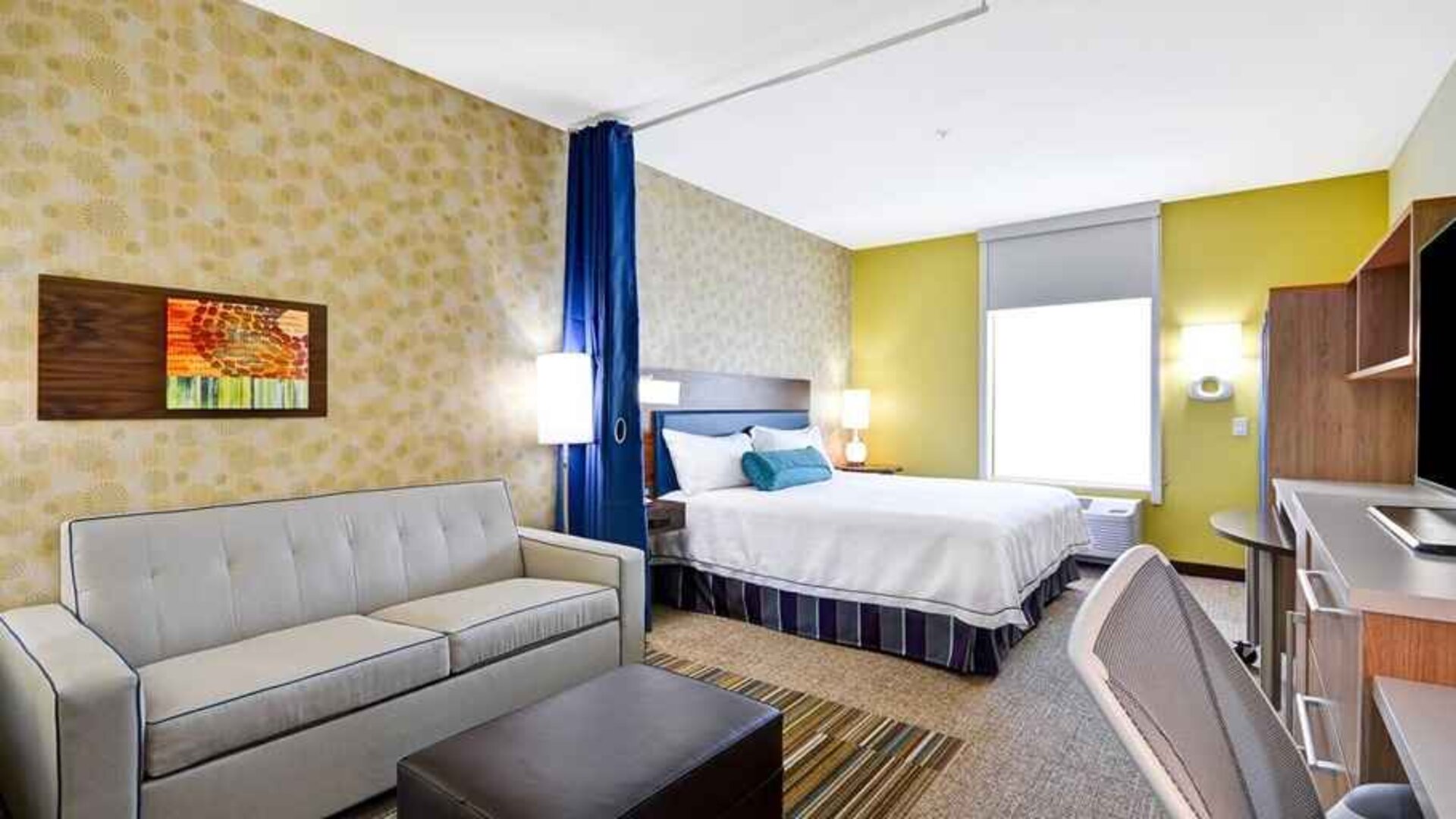 Luxurious king suite with lounge, TV, and work area at Home2 Suites by Hilton Fort Worth Southwest Cityview.