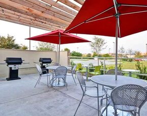Relaxing outdoor patio for coworking and down time at Home2 Suites by Hilton Fort Worth Southwest Cityview.