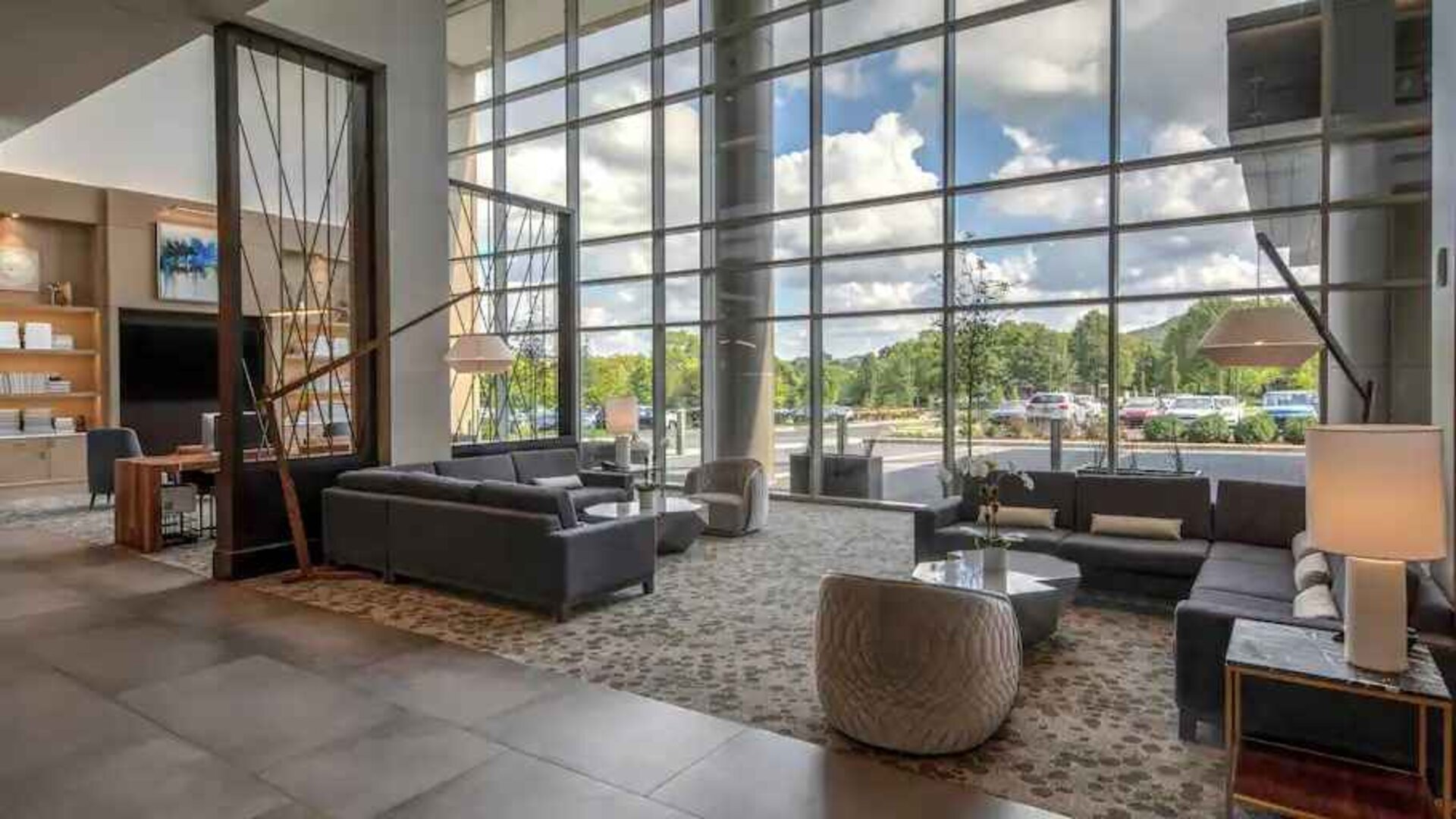 Beautiful lobby area with large windows and lounges perfect as workspace at the Hilton Franklin Cool Springs.