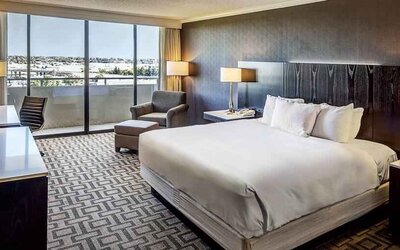 Comfortable king suite with city view at the Hilton Sacramento-Arden West.