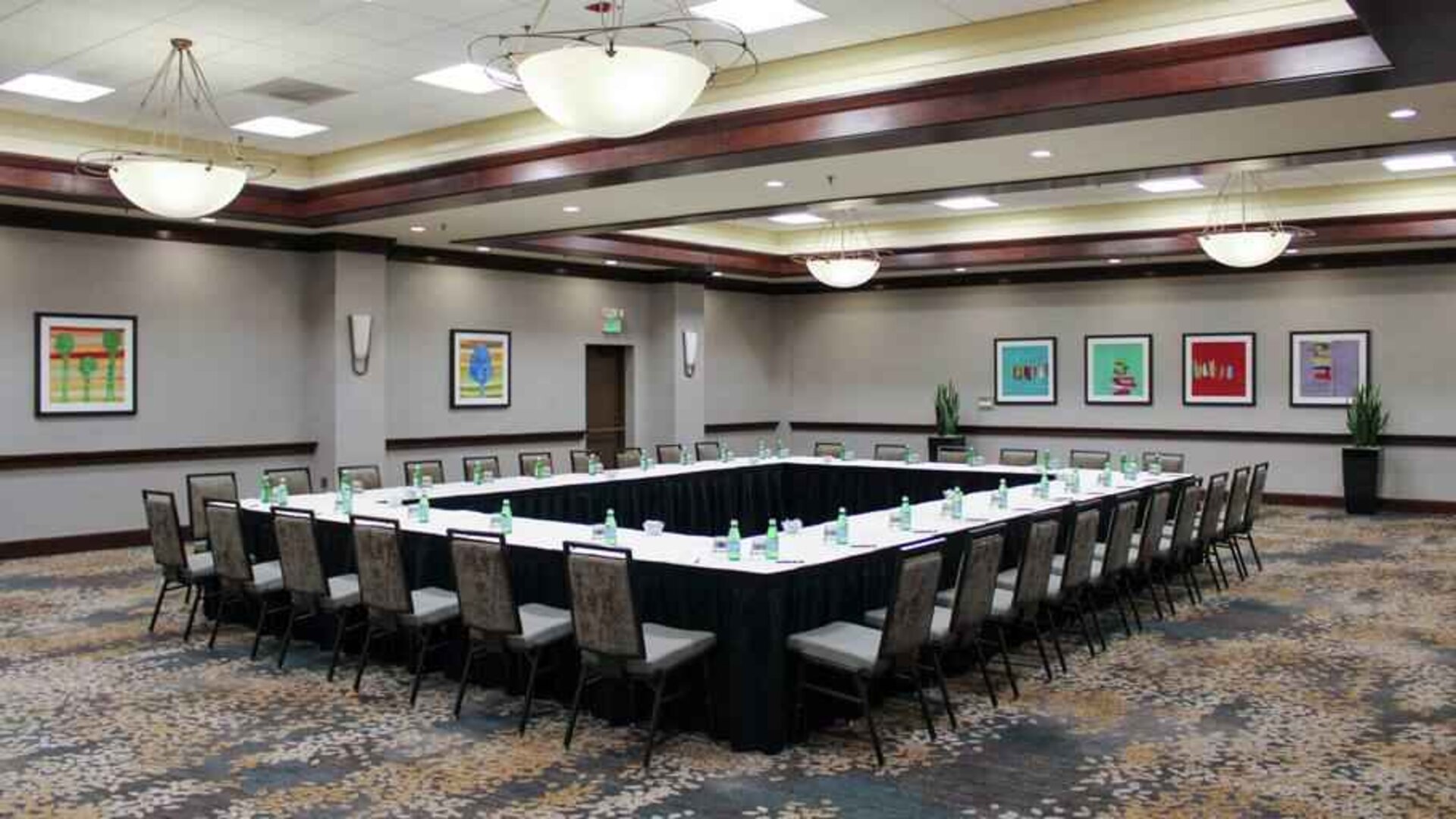 Meeting room with square conference table at the Hilton Sacramento-Arden West.