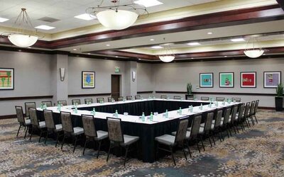 Meeting room with square conference table at the Hilton Sacramento-Arden West.